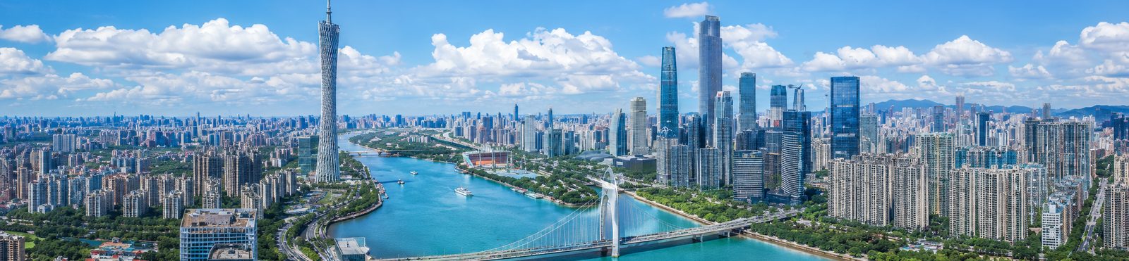 Guangzhou skyline by day with Canton Tower and Liede Bridge over the Pearl River